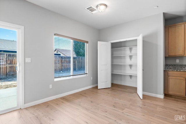6522 Bangor Pl, Bakersfield, CA 93313 - unfurnished bedroom with light wood-type flooring and access to outside