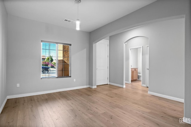 6522 Bangor Pl, Bakersfield, CA 93313 - unfurnished room with arched walkways and light wood-style flooring