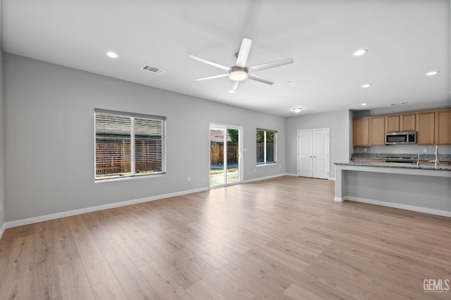 6522 Bangor Pl, Bakersfield, CA 93313 - unfurnished living room featuring ceiling fan, recessed lighting, and light wood-style floors