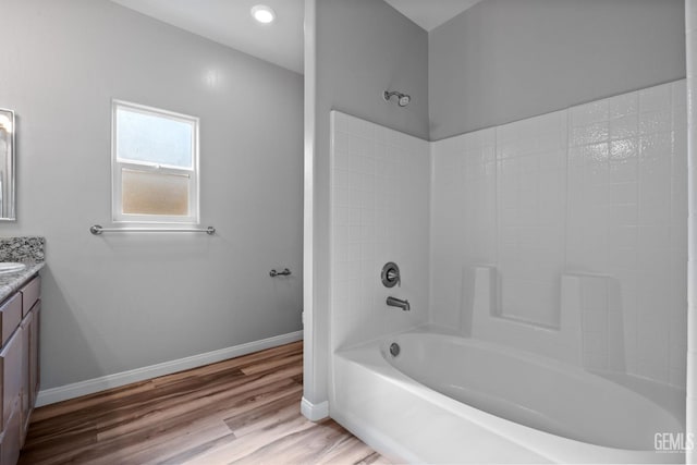 6522 Bangor Pl, Bakersfield, CA 93313 - full bath with vanity, bathing tub / shower combination, and wood finished floors