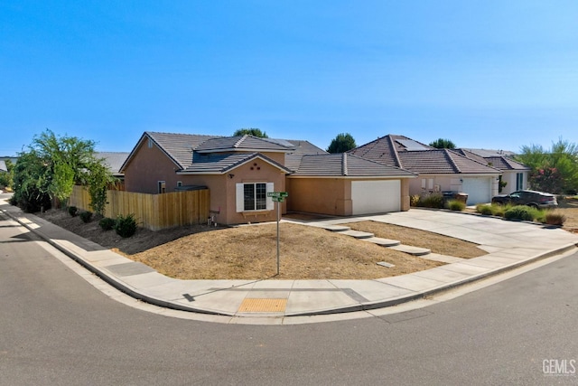 6522 Bangor Pl, Bakersfield, CA 93313 - view of front of house featuring concrete driveway, a garage, stucco siding, and a tile roof