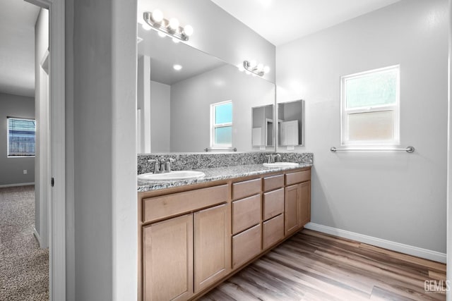 6522 Bangor Pl, Bakersfield, CA 93313 - full bath with double vanity and wood finished floors