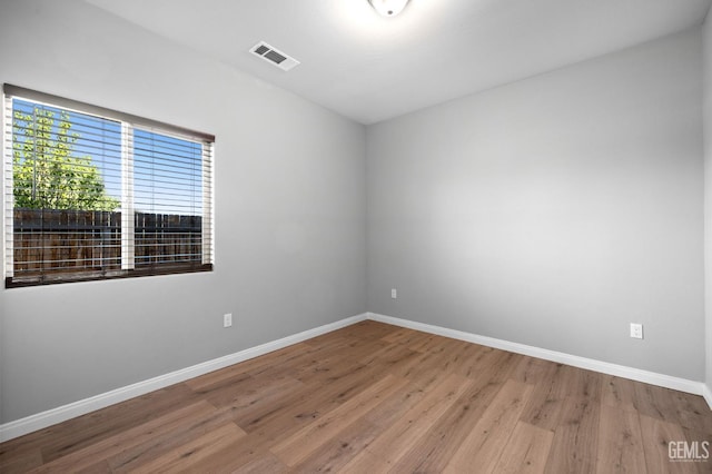 6522 Bangor Pl, Bakersfield, CA 93313 - spare room featuring baseboards and wood finished floors
