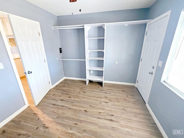 unfurnished bedroom featuring ceiling fan and light hardwood / wood-style flooring