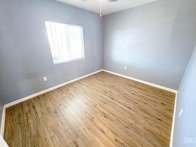spare room with light hardwood / wood-style flooring