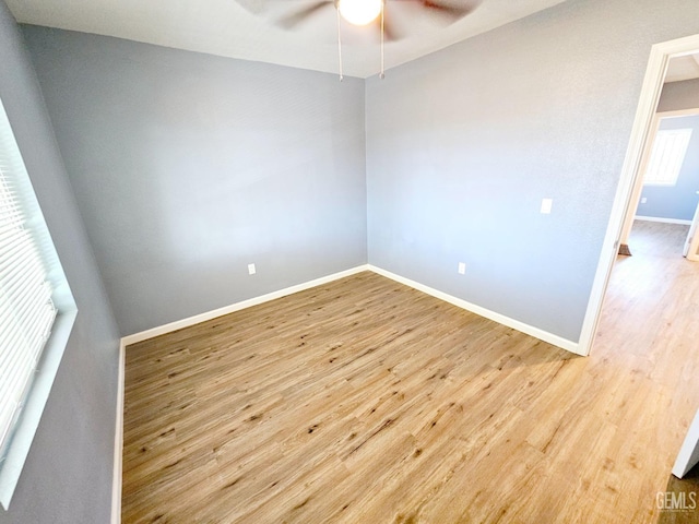 empty room featuring light hardwood / wood-style floors and ceiling fan