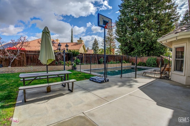 surrounding community with a patio area, a swimming pool, and a fenced backyard