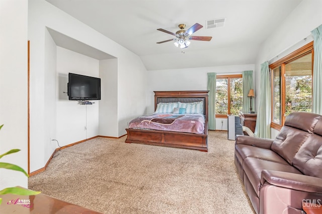 bedroom with lofted ceiling, carpet, visible vents, and baseboards