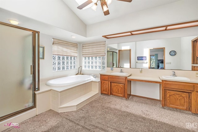 bathroom with a stall shower, a sink, carpet flooring, double vanity, and lofted ceiling