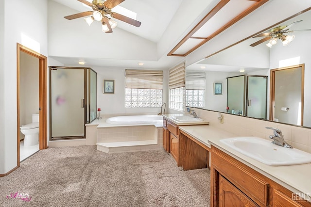 full bath with a garden tub, a stall shower, lofted ceiling, and a sink