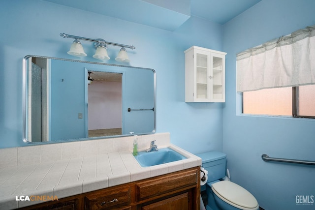 bathroom with vanity and toilet