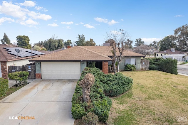 single story home featuring a garage and a front lawn