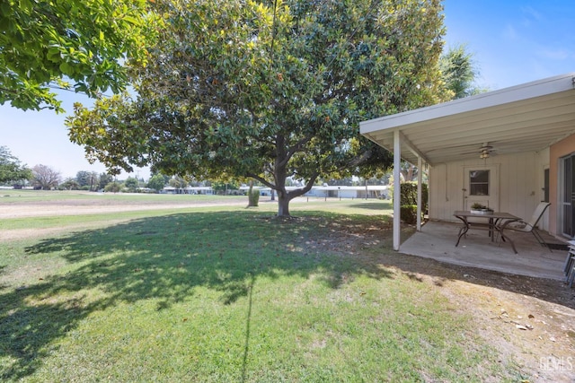 1112 Pebble Beach Dr, Bakersfield, CA 93309 - view of green lawn with ceiling fan and a patio area