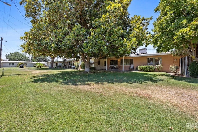 1112 Pebble Beach Dr, Bakersfield, CA 93309 - view of green lawn featuring a patio