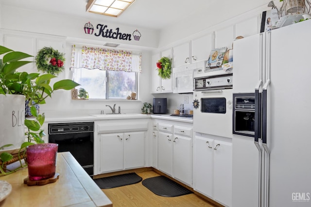 1112 Pebble Beach Dr, Bakersfield, CA 93309 - kitchen featuring white appliances, light countertops, and white cabinetry