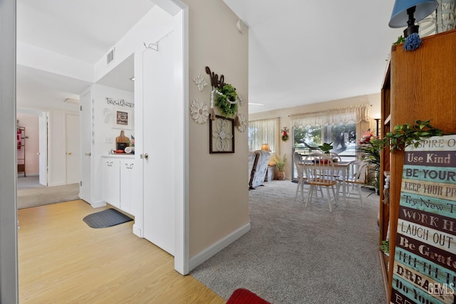1112 Pebble Beach Dr, Bakersfield, CA 93309 - corridor with light wood-style flooring and baseboards