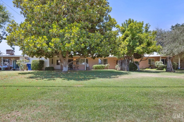 1112 Pebble Beach Dr, Bakersfield, CA 93309 - view of property hidden behind natural elements featuring a front yard and stucco siding