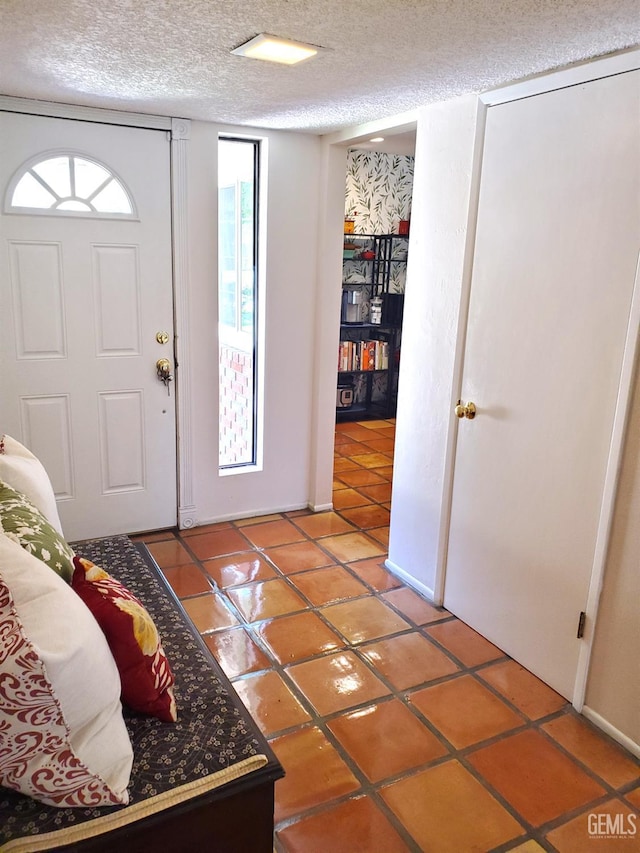 6333 Crestmore St, Bakersfield, CA 93308 - foyer entrance featuring light tile patterned flooring and a textured ceiling
