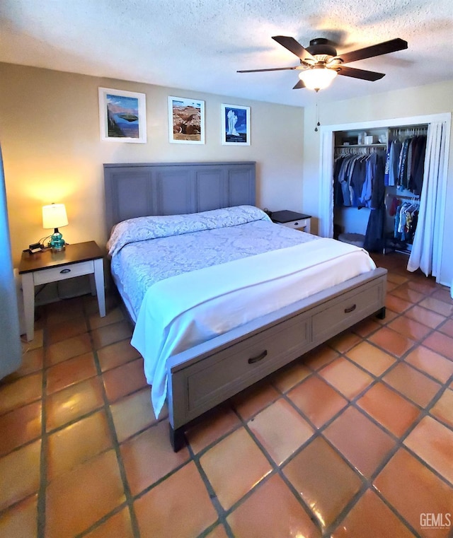 6333 Crestmore St, Bakersfield, CA 93308 - bedroom featuring a closet, a textured ceiling, light tile patterned floors, and a ceiling fan