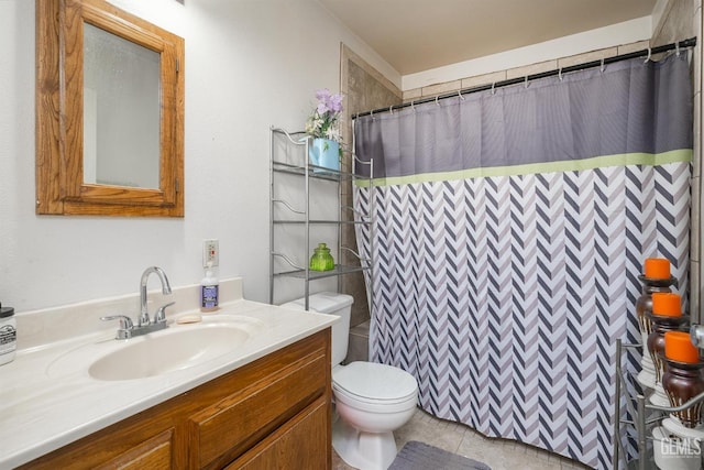 bathroom featuring tile patterned floors, vanity, curtained shower, and toilet