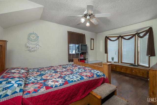 bedroom featuring a textured ceiling, dark hardwood / wood-style flooring, ceiling fan, and lofted ceiling