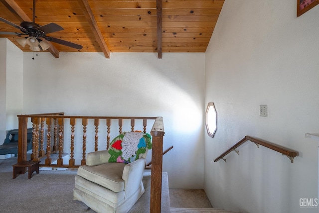 stairway featuring carpet flooring, ceiling fan, beam ceiling, high vaulted ceiling, and wooden ceiling