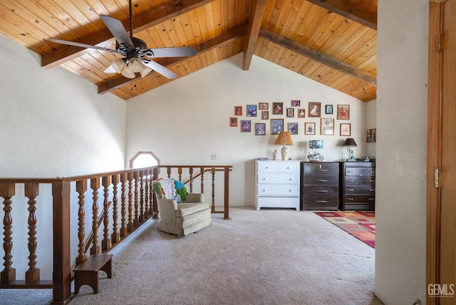 sitting room with beam ceiling, light colored carpet, ceiling fan, and wood ceiling