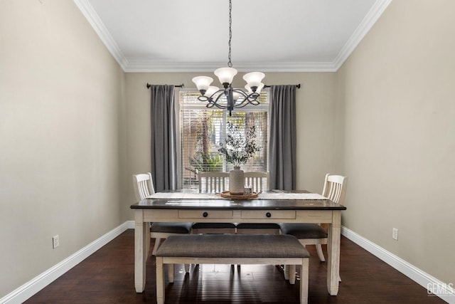 dining space featuring ornamental molding, dark hardwood / wood-style floors, and a chandelier