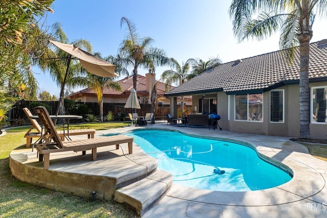 view of swimming pool with outdoor lounge area and a patio area