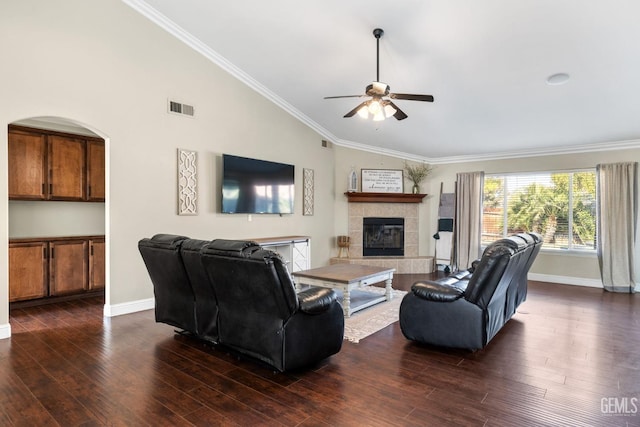 living room with crown molding, dark hardwood / wood-style floors, and vaulted ceiling