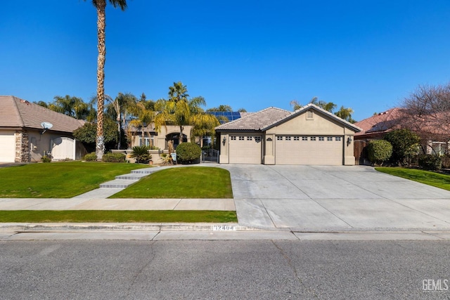 single story home featuring a garage and a front lawn