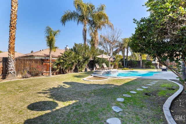 view of yard with a fenced in pool