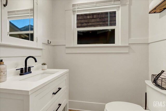 930 S Roosevelt Ave, Fresno, CA 93728 - half bathroom featuring toilet and vanity