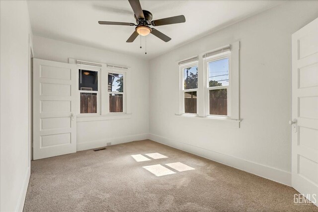 930 S Roosevelt Ave, Fresno, CA 93728 - carpeted spare room with ceiling fan and baseboards