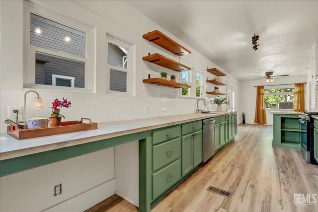 930 S Roosevelt Ave, Fresno, CA 93728 - kitchen featuring green cabinetry, stainless steel appliances, backsplash, open shelves, and light countertops