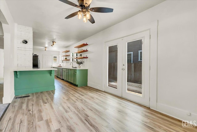 930 S Roosevelt Ave, Fresno, CA 93728 - kitchen featuring green cabinetry, french doors, refrigerator, and light wood-style flooring