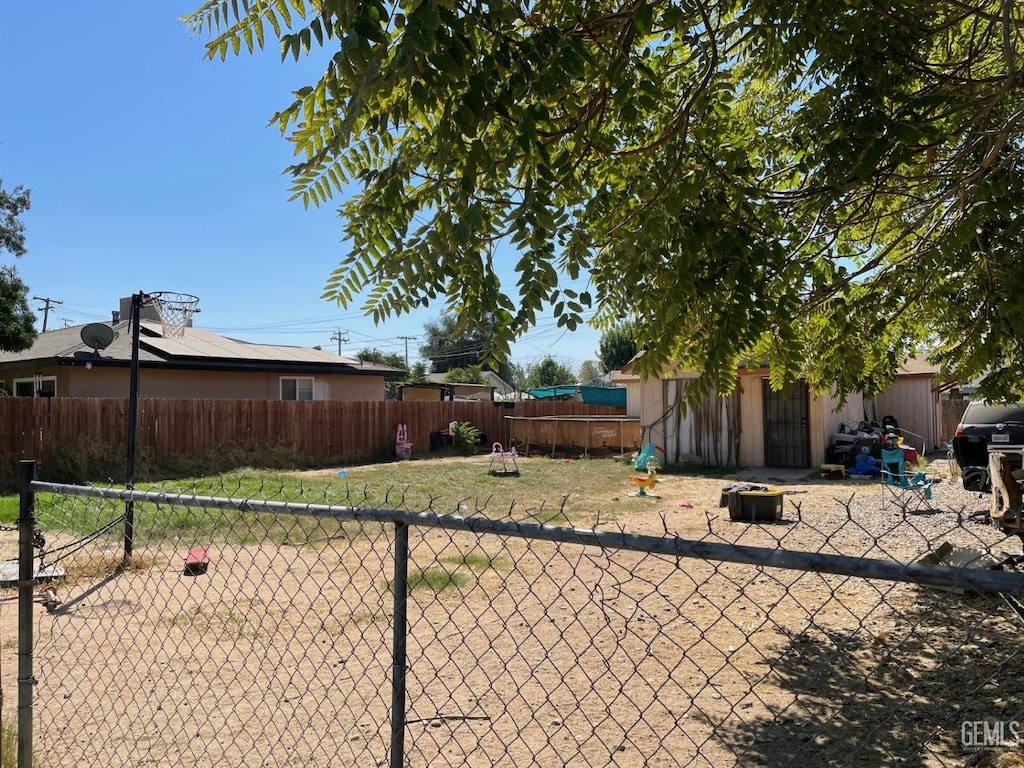 view of yard featuring a trampoline