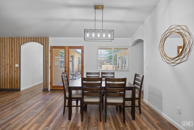 6418 Abby Rose Ave, Bakersfield, CA 93308 - dining space featuring wood finished floors, arched walkways, baseboards, and french doors