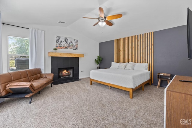 6418 Abby Rose Ave, Bakersfield, CA 93308 - bedroom with vaulted ceiling, carpet flooring, a tile fireplace, and ceiling fan