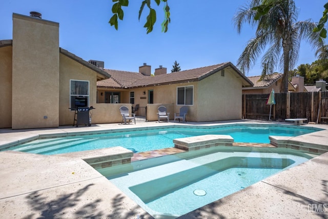6418 Abby Rose Ave, Bakersfield, CA 93308 - view of pool with a pool with connected hot tub, fence, and a patio