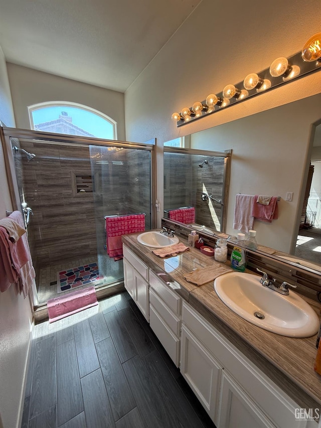 3910 Mariana Way, Bakersfield, CA 93311 - full bathroom with double vanity, a stall shower, and wood finished floors