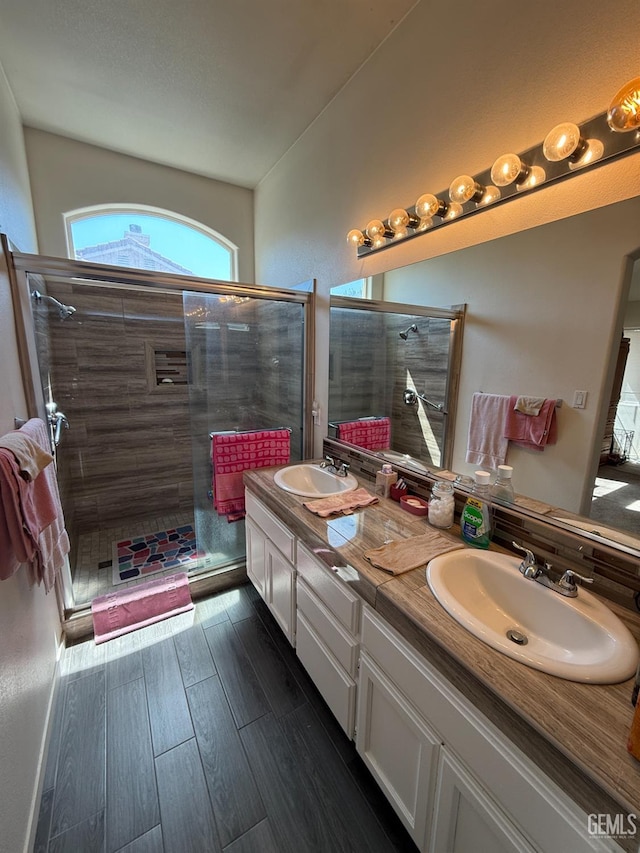 3910 Mariana Way, Bakersfield, CA 93311 - full bath with a stall shower, double vanity, and wood finished floors