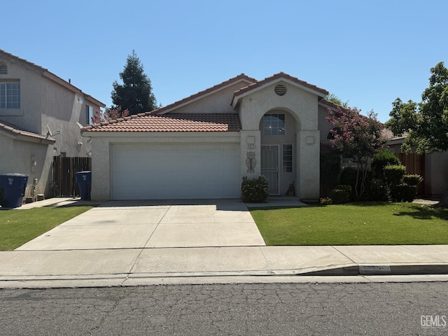 3910 Mariana Way, Bakersfield, CA 93311 - view of front of property featuring an attached garage, stucco siding, driveway, and a tile roof