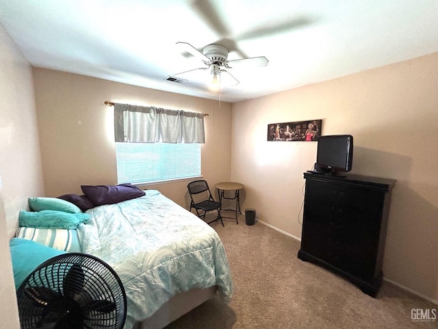 carpeted bedroom featuring ceiling fan