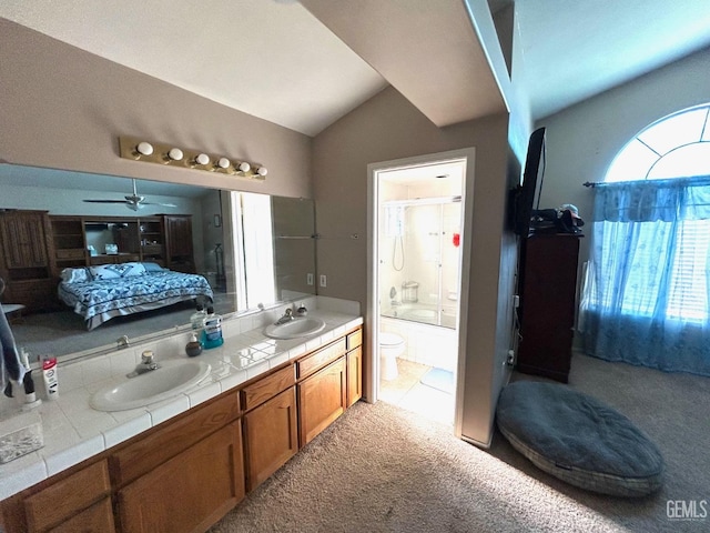 full bathroom with lofted ceiling, shower / bath combination with glass door, ceiling fan, vanity, and toilet