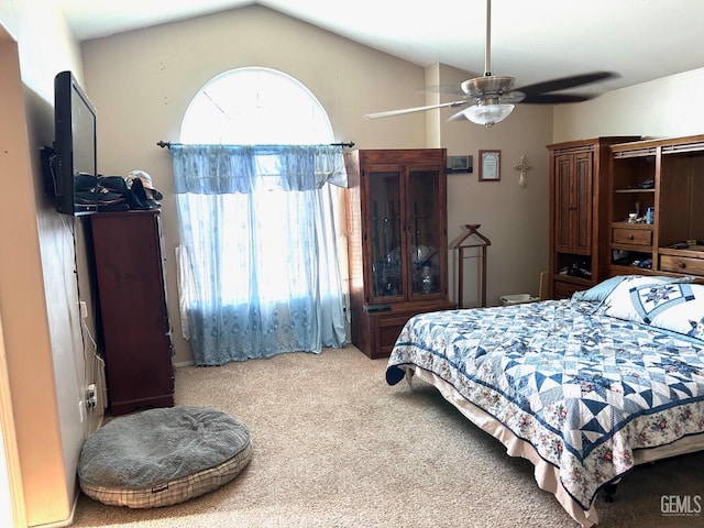 carpeted bedroom with lofted ceiling and ceiling fan