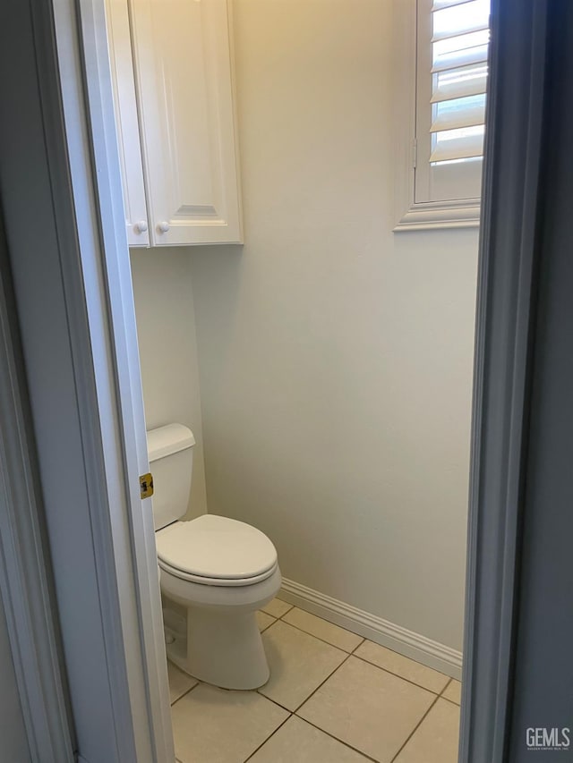10011 Rosebud Ave, Bakersfield, CA 93311 - bathroom featuring tile patterned flooring, baseboards, and toilet