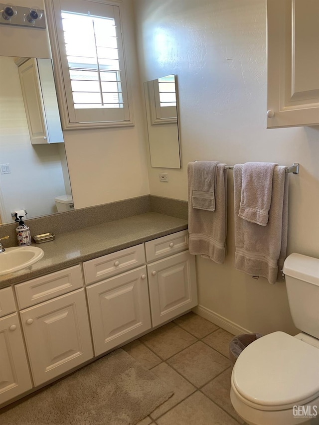 10011 Rosebud Ave, Bakersfield, CA 93311 - bathroom featuring toilet, tile patterned flooring, and vanity