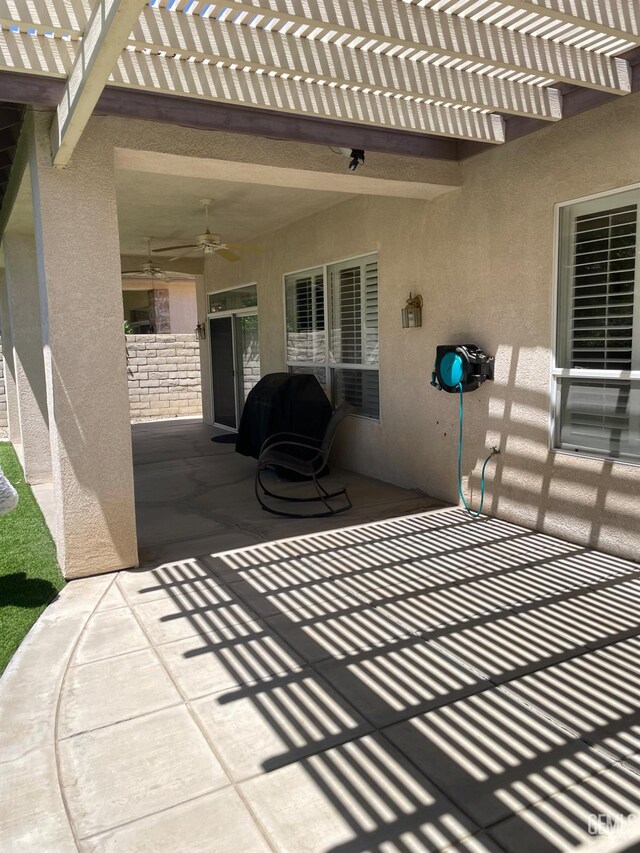10011 Rosebud Ave, Bakersfield, CA 93311 - view of patio / terrace featuring a ceiling fan and a pergola