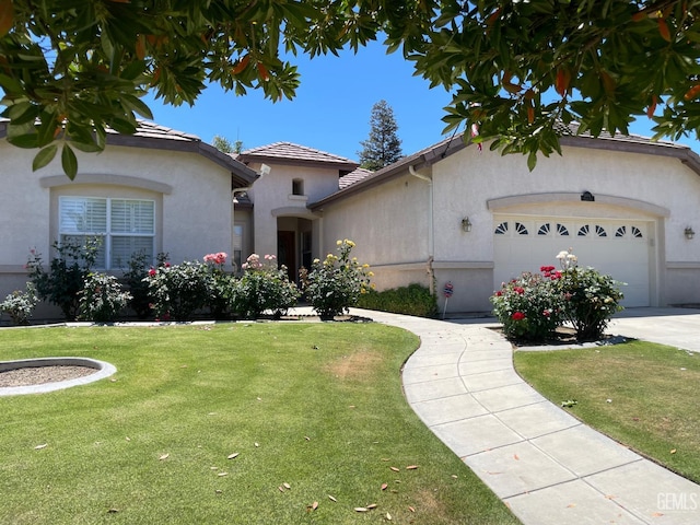 10011 Rosebud Ave, Bakersfield, CA 93311 - view of front of property featuring an attached garage, a front lawn, a tile roof, stucco siding, and driveway